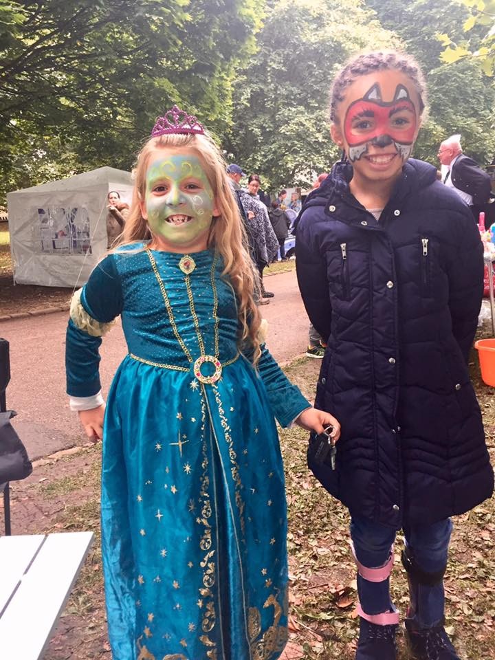 Two girls show off there face paintings